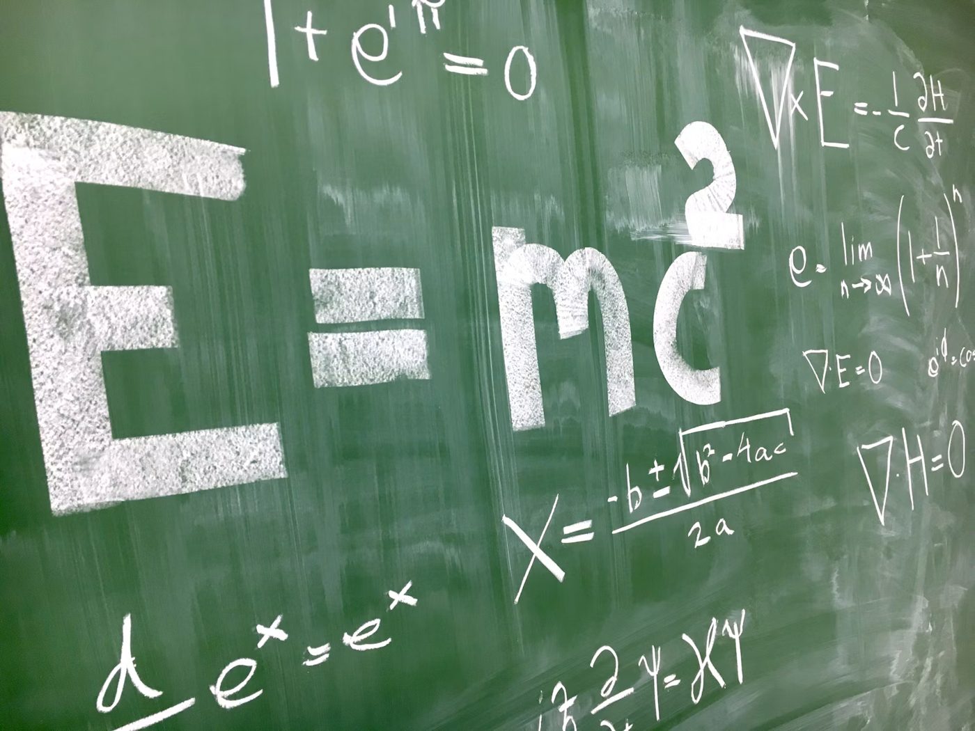 IIT-JEE Maths and Physics formulas on a chalkboard